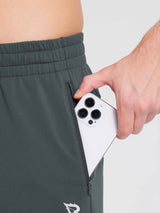 Men's dark grey fleece jogger pants with zippered pocket for phone. #color_Dark Gray