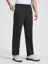 Man placing phone in pocket of Baleaf black UPF 50+ 5-pocket golf pants. #color_Black