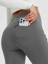 Grey fleece-lined 25" yoga leggings with smartphone in zippered back pocket. #color_Dark Gray