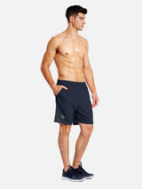 Men's navy 7" quick dry running shorts with built-in brief liner and side mesh panels. #color_Navy Blue