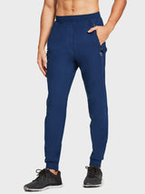 Men's navy lightweight jogger pants with zipper pockets, mesh panels and tapered cuffs. #color_Navy Blue