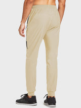 Lightweight beige men's jogger running pants with zippered pockets and elastic tapered cuffs. #color_Light Brown