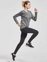 Woman running in grey long-sleeve UPF 50+ quick-dry running shirt and black leggings. #color_Heather Gray