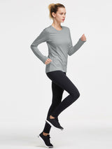 Grey thermal fleece crew pullover with thumbholes, on woman running in black leggings. #color_Light Gray