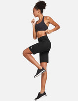 Woman running in black Laureate High Rise Bermuda Shorts and sports bra. #color_Black