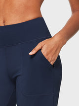 Navy Laureate High Rise Bermuda Shorts with side pocket, hand placed inside. #color_Navy