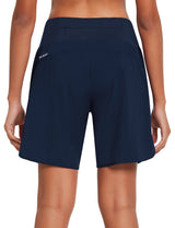 Women's navy 7-inch running shorts with built-in liner, back view showing zippered pocket and ALEAF logo. #color_Navy Blue