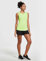 Lime green women's breathable sleeveless workout tank top, loose fit, with black athletic shorts #color_Light Green