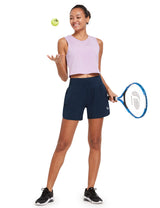 Navy blue A-line 5" quick-dry running shorts on woman with tennis racket #color_Navy Blue