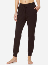 Women's black tapered cotton sweatpants with drawstring, cuffed ankles, and subtle logo. #color_Dark Brown
