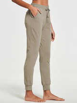 Women's tapered cotton sweatpants in taupe, with drawstring waist and cuffed ankles. #color_Khaki
