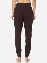 Women's dark tapered cotton sweatpants with cuffed ankles and back pockets #color_Dark Brown