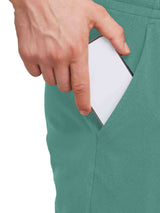 Men's teal cotton lounge pants with deep front pockets, one holding a smartphone. #color_Green