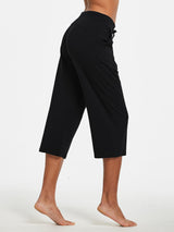 Black women's lightweight wide-leg cotton capri pants with pockets and drawstring. #color_Black