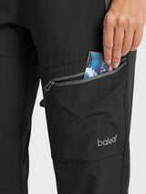 Black baleaf DWR hiking pants with zippered pocket for travel.