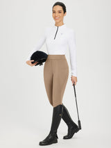 Women's tan full-seat silicone breeches with fleece lining, white shirt, black boots. #color_Brown