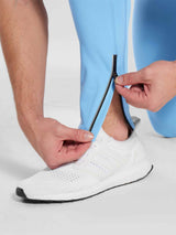 Men's 30" blue fleece-lined cycling tights with ankle zipper & reflective stripe. #color_Blue