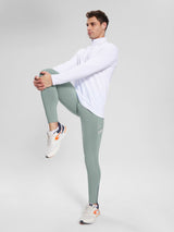 Men's fleece-lined cycling tights in grey, showing ankle zip and reflective stripe. #color_Gray