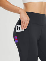 Dark grey fleece-lined cycling leggings with phone in slip pocket and zippered pocket. #color_Black