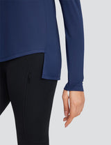 Navy blue long sleeve crew neck t-shirt with side slits, paired with black leggings with a zippered pocket.