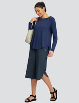 Loose navy blue crew neck long sleeve t-shirt with dark culottes on a model