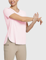 Woman in pink UPF 50+ tee and khaki trail shorts, stretching comfortably. #color_Pink