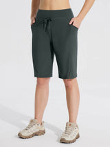 Women's dark gray 11" quick-dry cargo shorts with drawstring waist and pockets, tan hiking shoes. #color_Dark Gray