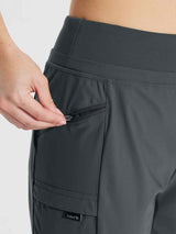 Woman zipping a side pocket on dark gray quick-dry hiking cargo shorts with a visible Baleaf logo. #color_Dark Gray
