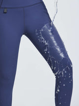 Outdoor navy blue thermal knit leggings, water resistant test. #color_Navy Blue