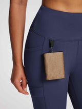 Navy knit fleece leggings with deep side pocket carrying a wallet #color_Navy Blue