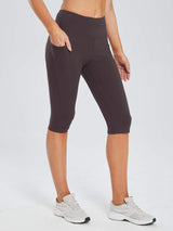 Women's plus size dark brown knee-length capris with pockets and elastic waistband. #color_Dark Brown