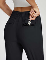 Black adventure pants featuring a secure zippered pocket for keys. #color_Black