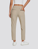 Beige UPF 50+ high-rise active pants with zippered pockets, part of adventure-ready set. #color_Khaki
