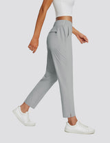 Baleaf grey UPF 50+ high-rise 4-pocket 26" adventure pants with white sneakers. #color_Light Grey