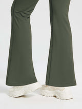 High-waist fleece-lined olive green flare pants with drawstring, bootcut hem, and sneakers. #color_Army Green
