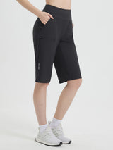 Black 14" casual cycling capris with zippered thigh pocket and reflective hem detail. #color_Black