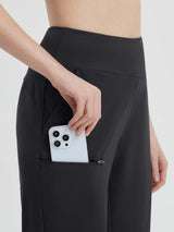 Black 14" casual cycling capris with phone in zippered pocket.