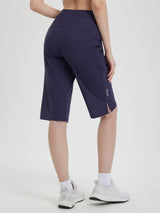 Women's navy blue 14-inch casual cycling capris, elastic waist, hip pockets, white logo, leg slits. #color_Navy Blue