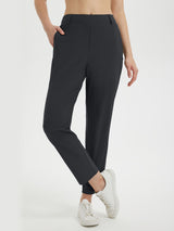 Black lightweight, stretchy women's 27-inch golf pants with a comfortable elastic waistband. #color_Black
