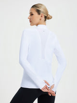 White women's fleece skiing pullover base layer with mock neck and thumb holes. #color_White