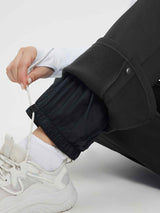 Black knit heavyweight fleece ski pants ankle cuff detail with drawstring. #color_Black