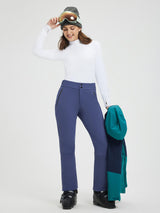 Model in blue knit heavyweight fleece straight ski pants with zippered pockets. #color_Navy Blue