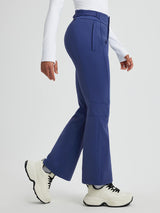 Blue women's softshell ski pants with a slightly flared leg and articulated knees.
