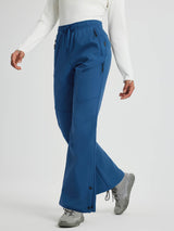 Women's blue softshell straight-leg outdoor pants with zipper pockets and snap closures. #color_Cobalt Blue