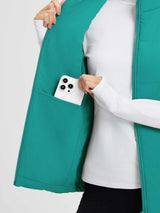 Teal quilted Dupont insulated vest interior with pocket holding phone #color_Green