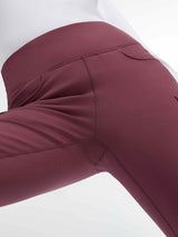 Women's burgundy fleece-lined flared pants with cargo pockets and high rise waist. #color_Wine Red