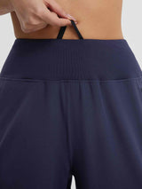 Close-up of navy blue women's 9" high-waisted running shorts waistband with adjustable drawstring. #color_Navy Blue