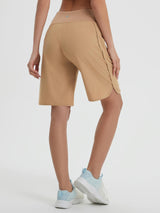Tan women's 9-inch high-waisted running shorts with loose fit, curved hem, and side zipper pockets. #color_Brown