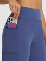 Secret Breeze 12" High-Rise Shorts in blue featuring a zippered pocket with phone and card. #color_Blue