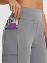 Grey high-rise outdoor shorts with zippered pocket and phone storage. #color_Gray